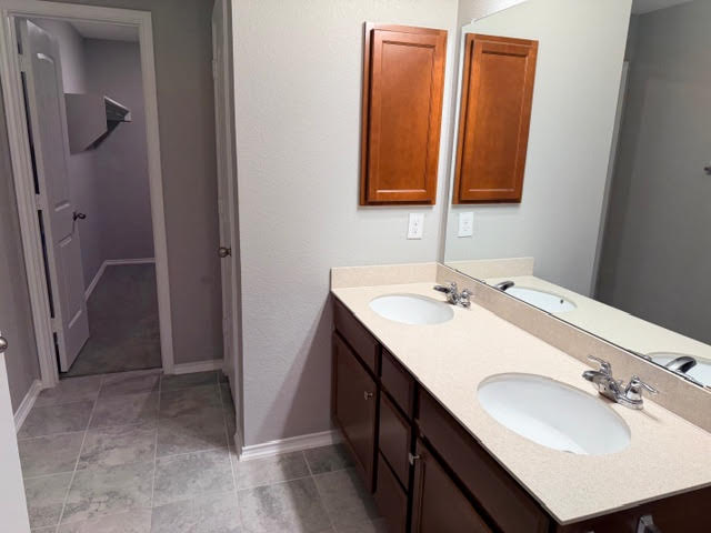 329 Los Cobos Lane Georgetown, TX 78626 - Photo 23 of 40 a bathroom with a sink and a mirror