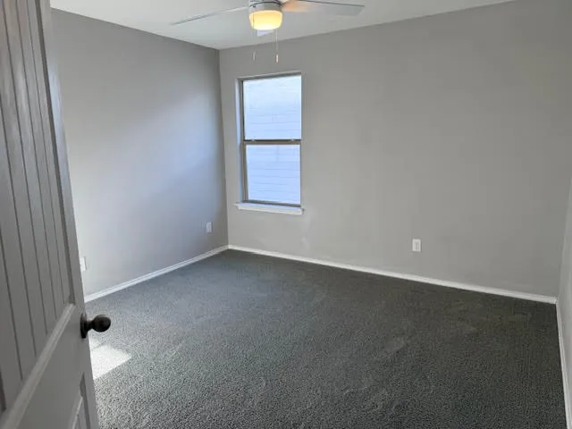 a bathroom with a sink a toilet a mirror and shower