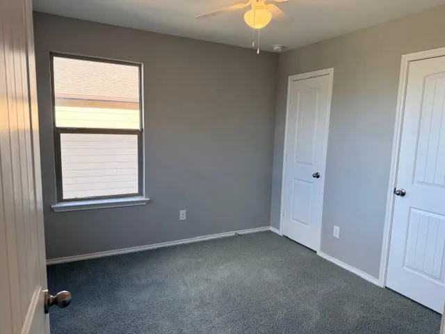 a view of a chairs and table in patio