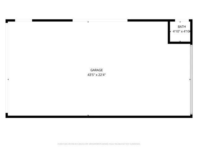 a picture of a room with a white wall and a potted plant