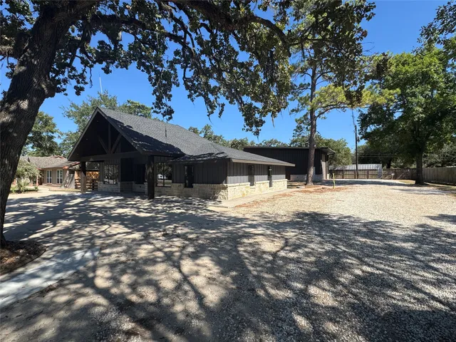 a view of house with yard