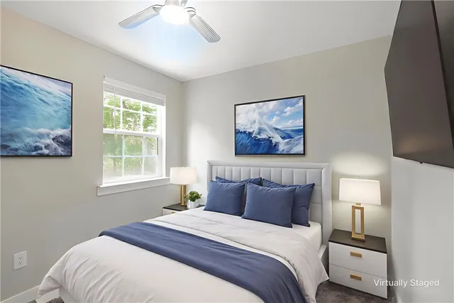 a bedroom with bed and window