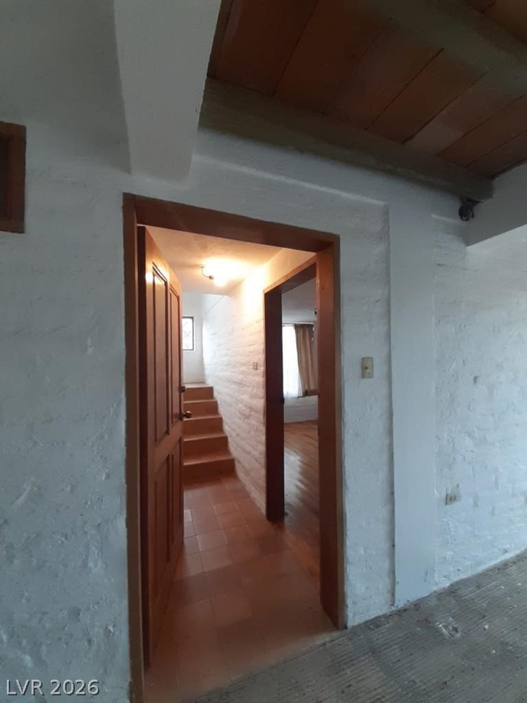 970 La Rabija Shermans Dale, OS 17090 - Photo 5 of 18 Two open doorways lead to a charming interior, with stairs visible through one.