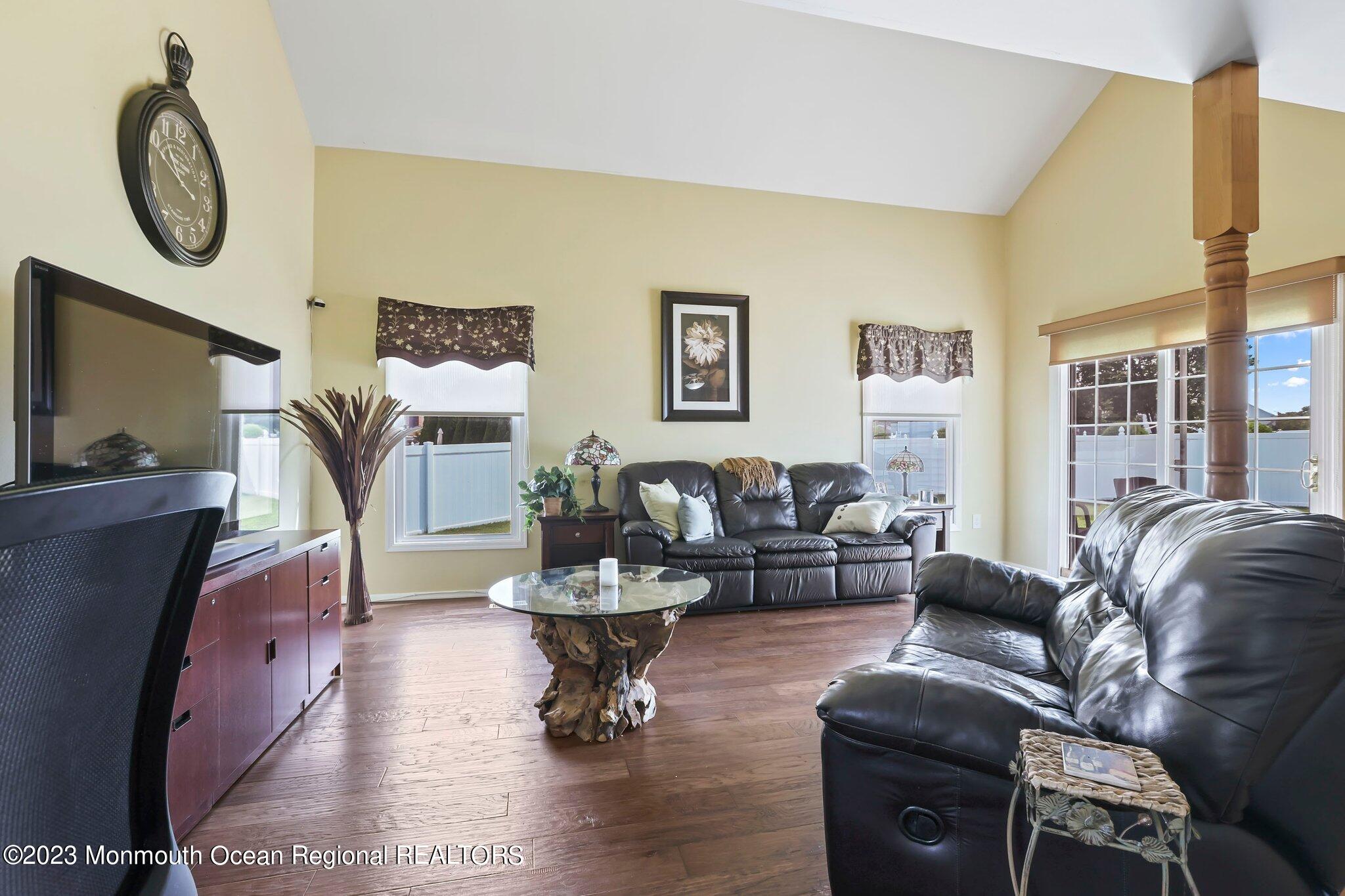 31 Daniel Drive Hazlet, NJ 07730 - Photo 15 of 31 a living room with furniture a rug and a mirror