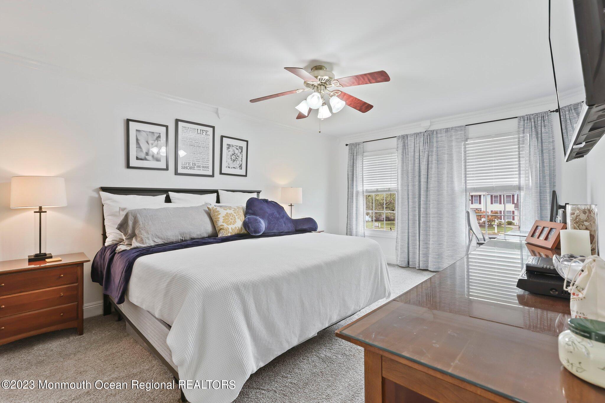 31 Daniel Drive Hazlet, NJ 07730 - Photo 19 of 31 a bed room with a bed and a couch