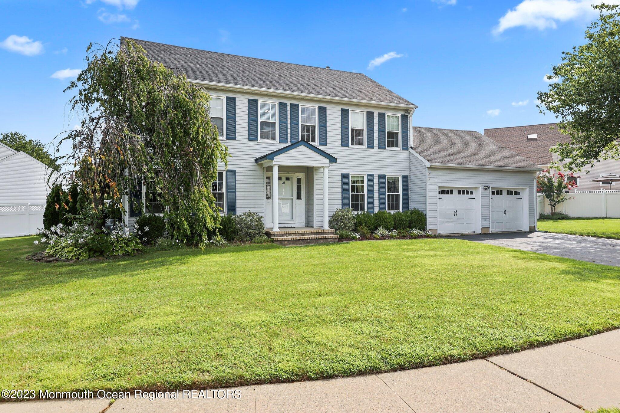 31 Daniel Drive Hazlet, NJ 07730 - Photo 2 of 31 a front view of a house with a garden