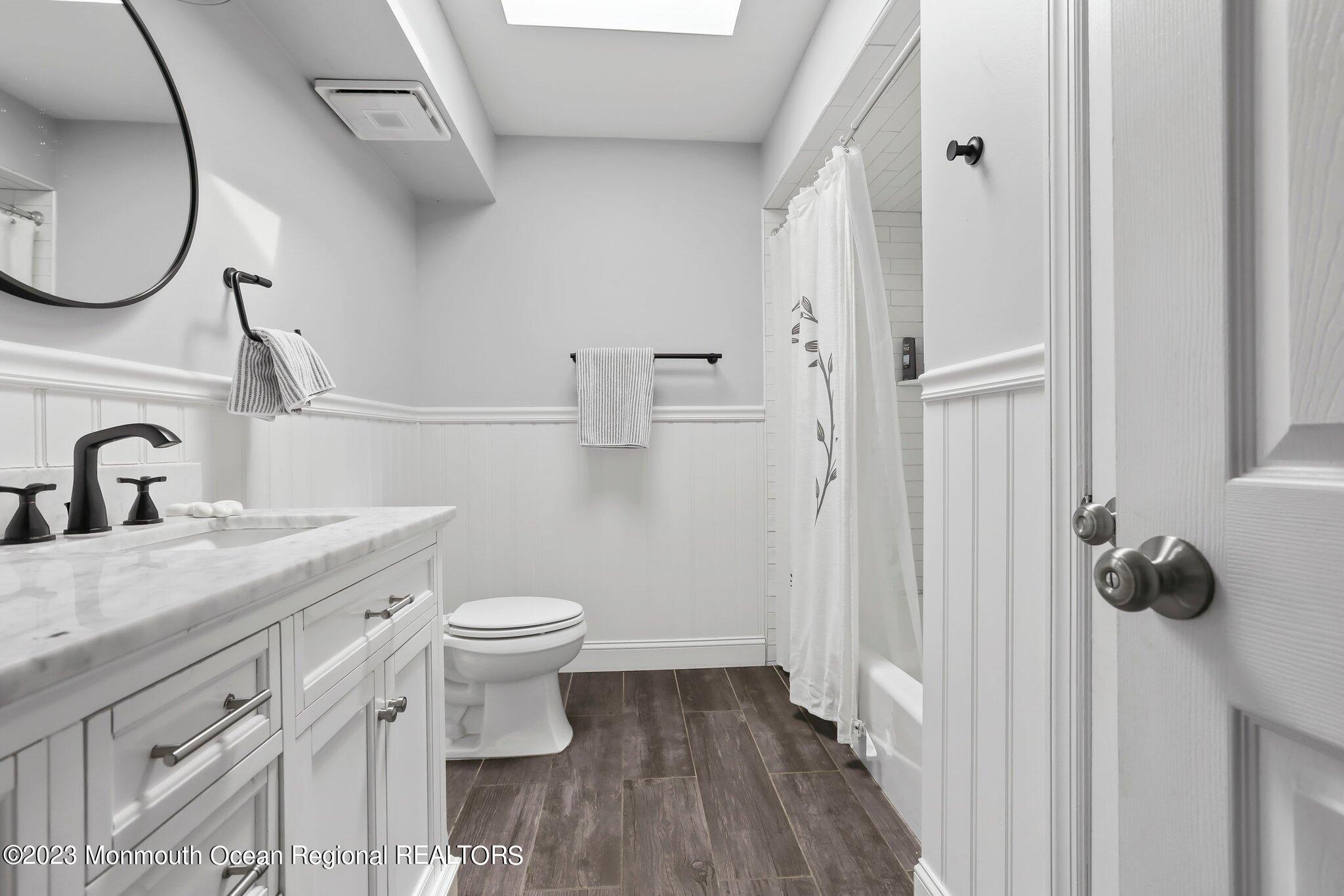 31 Daniel Drive Hazlet, NJ 07730 - Photo 26 of 31 a bathroom with a granite countertop toilet sink and mirror