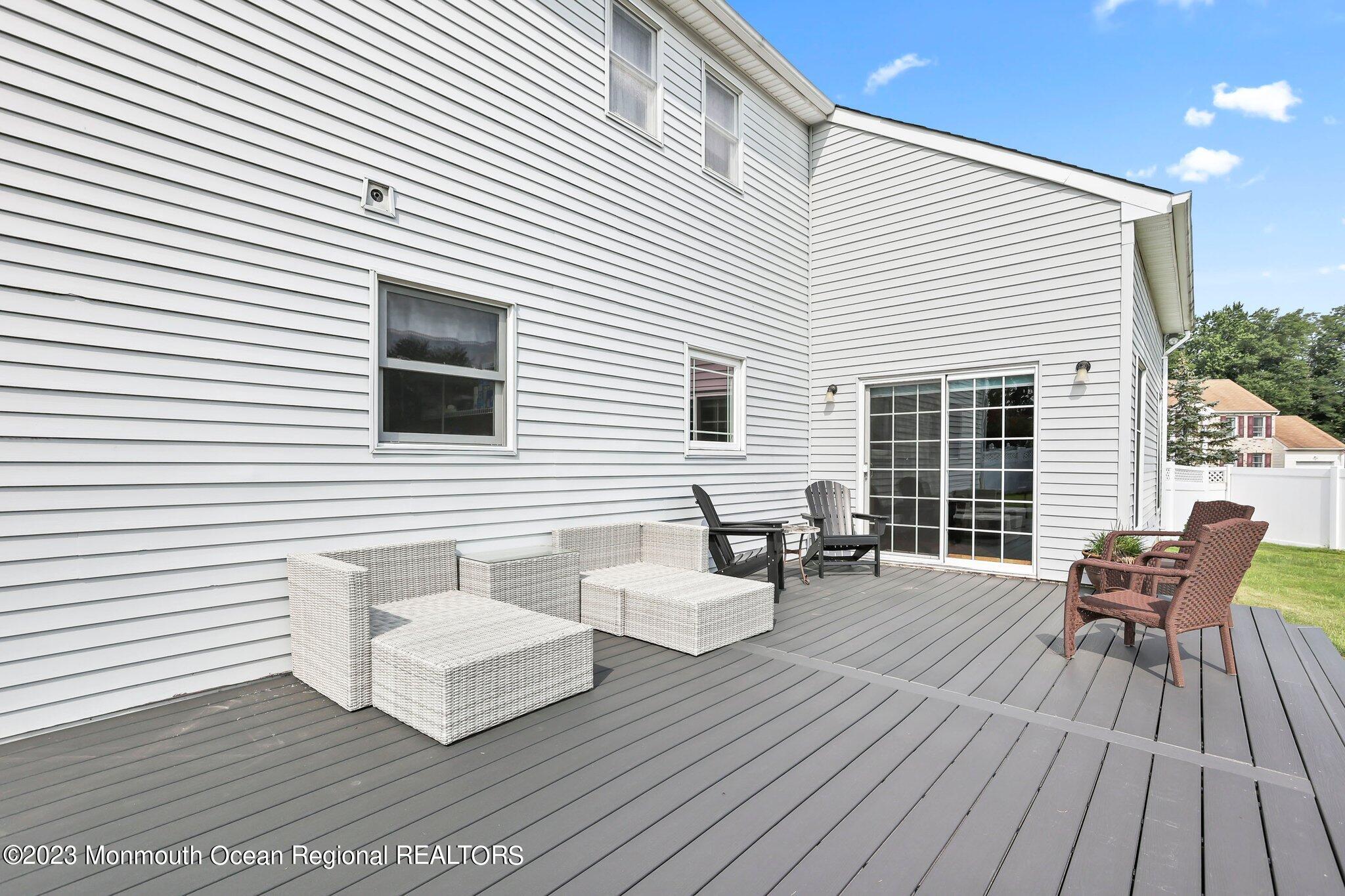 31 Daniel Drive Hazlet, NJ 07730 - Photo 27 of 31 a view of table and chairs in wooden floor