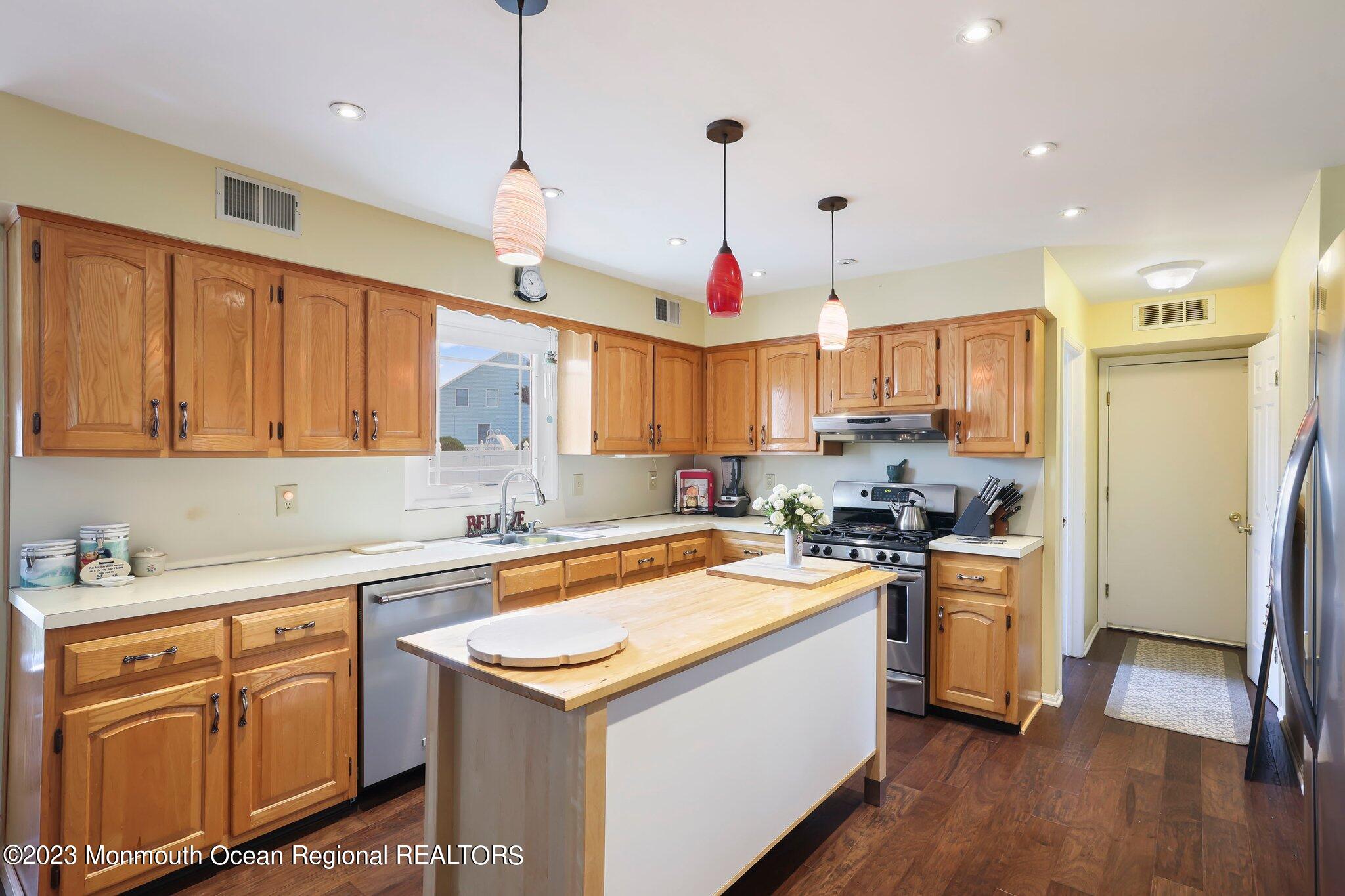 31 Daniel Drive Hazlet, NJ 07730 - Photo 9 of 31 a kitchen with a sink a stove a refrigerator and a window