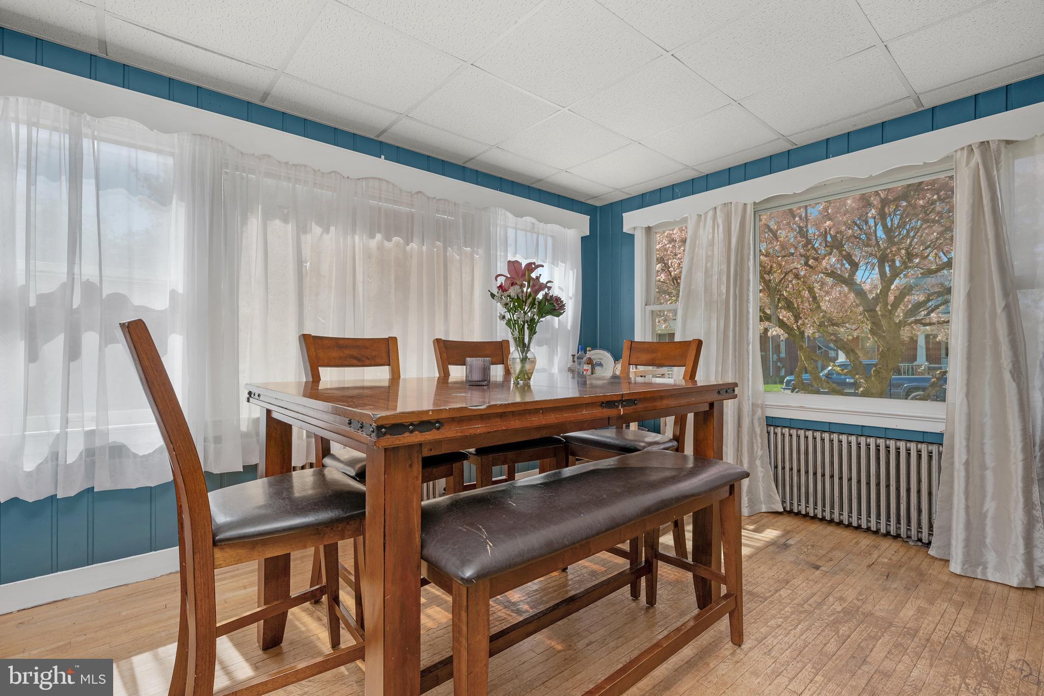 730 McAllister Street Hanover, PA 17331 - Photo 16 of 46 a view of a dining room with furniture window and wooden floor