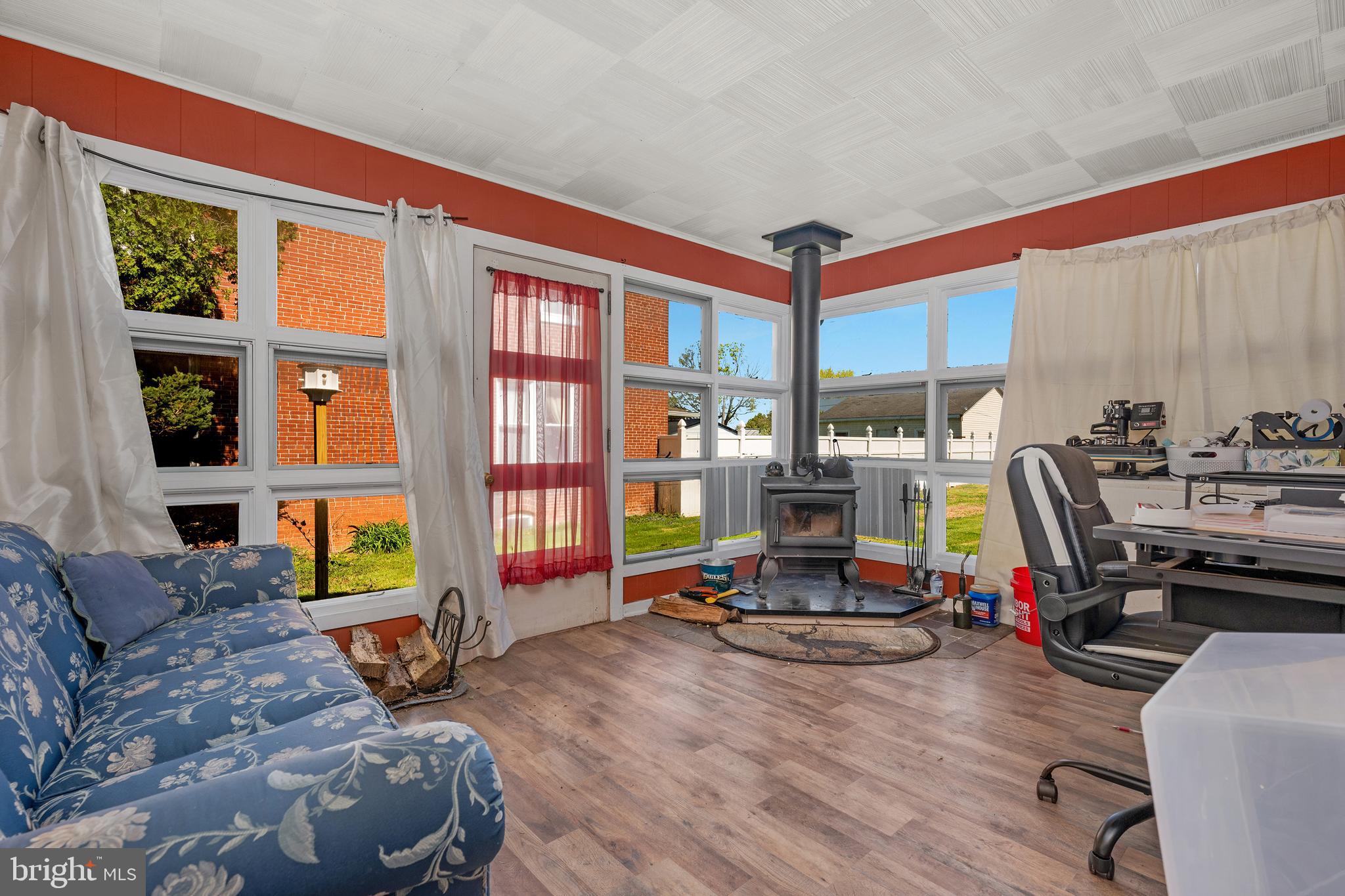 730 McAllister Street Hanover, PA 17331 - Photo 17 of 46 a living room filled with furniture and a gym