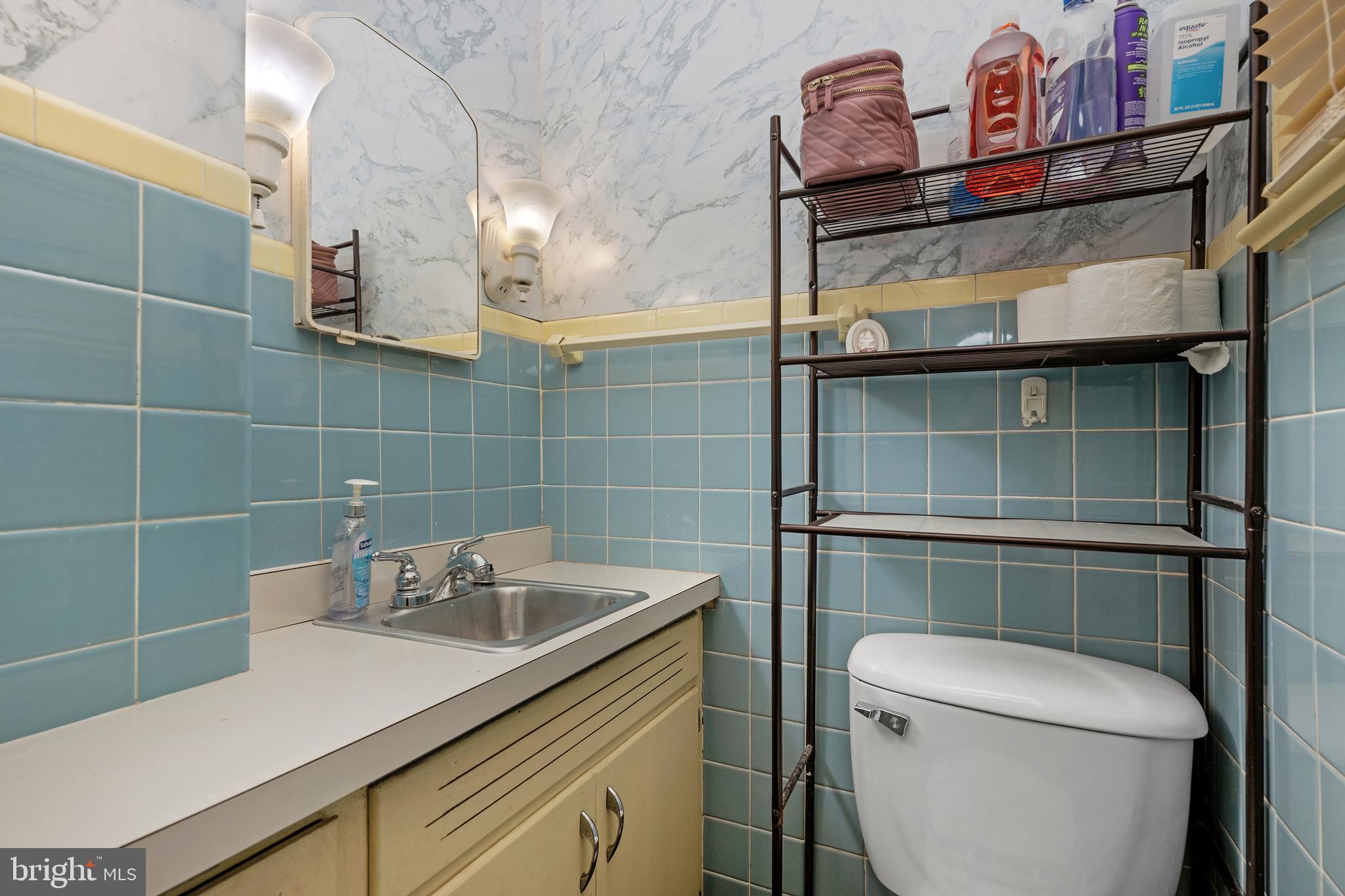 730 McAllister Street Hanover, PA 17331 - Photo 18 of 46 a bathroom with a sink a toilet and shower