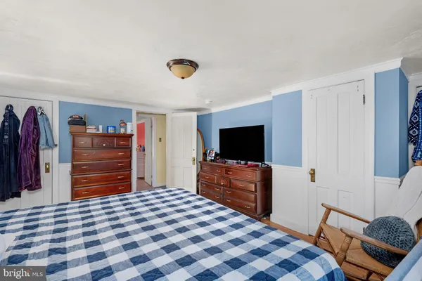 a bedroom with a bed and furniture