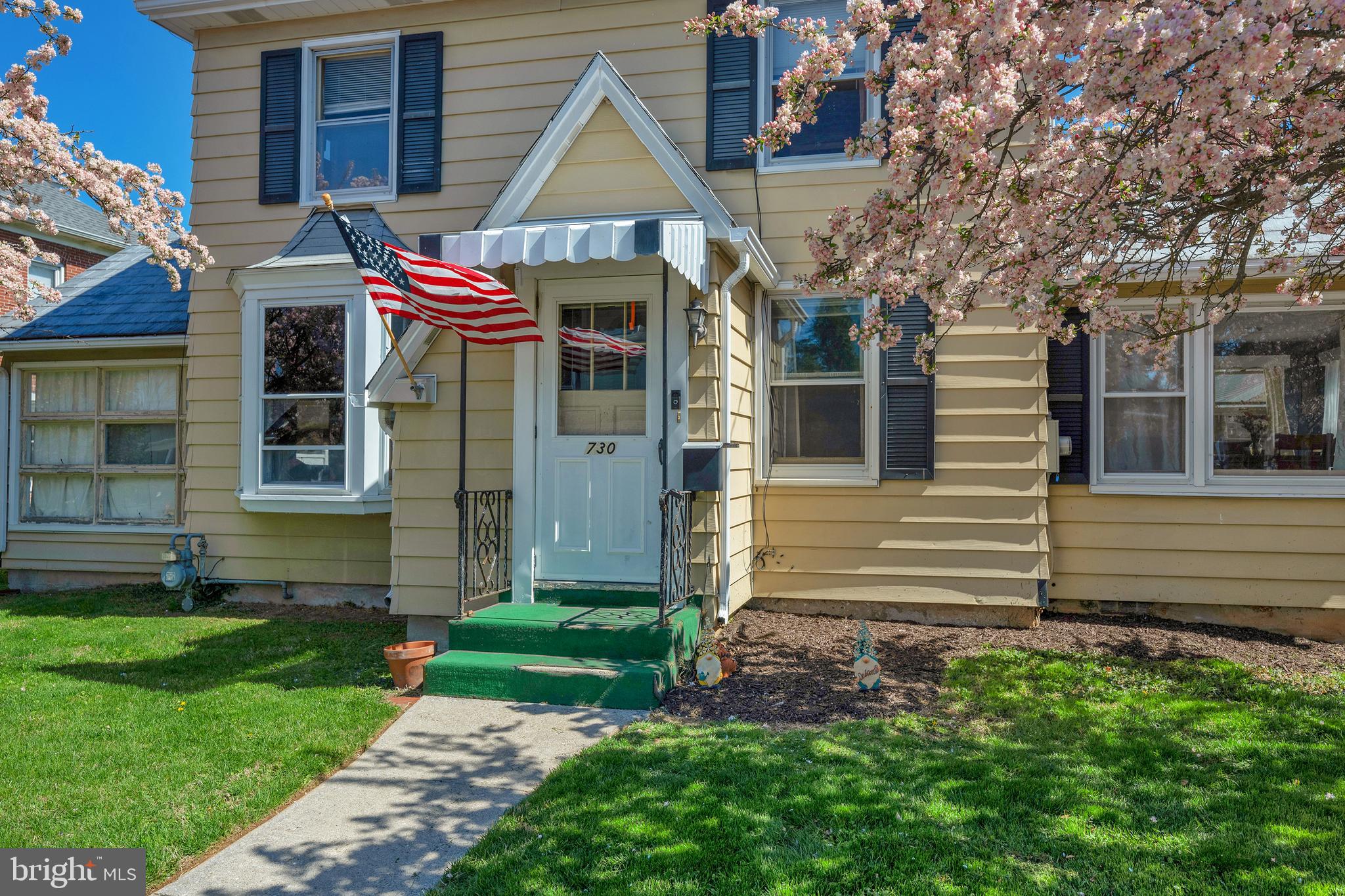 730 McAllister Street Hanover, PA 17331 - Photo 2 of 46 a view of a house with a small yard and a large tree front of it