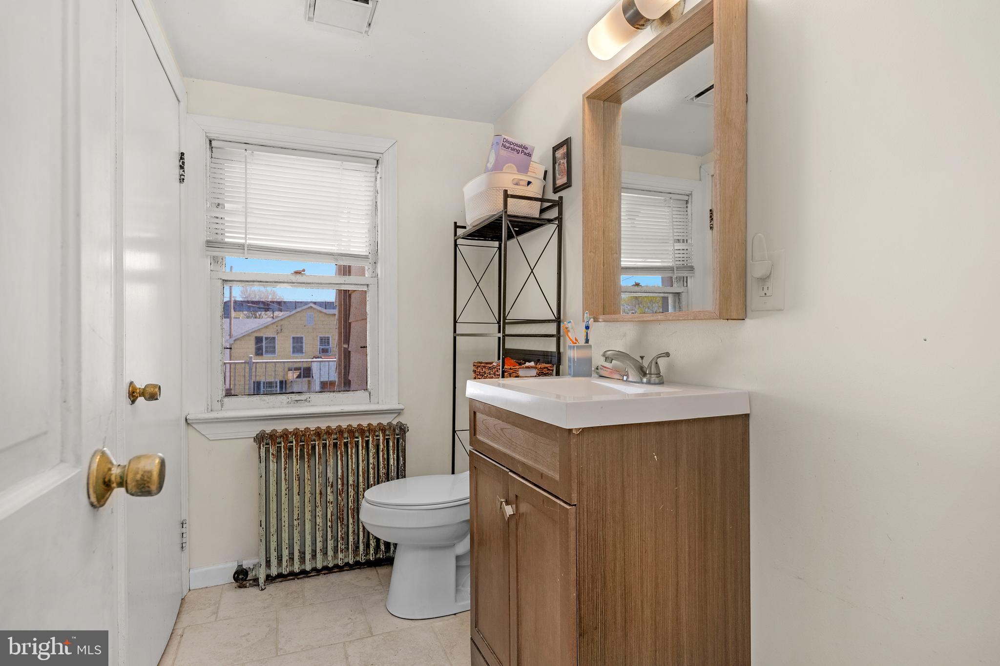 730 McAllister Street Hanover, PA 17331 - Photo 21 of 46 a bathroom with a sink toilet and shower