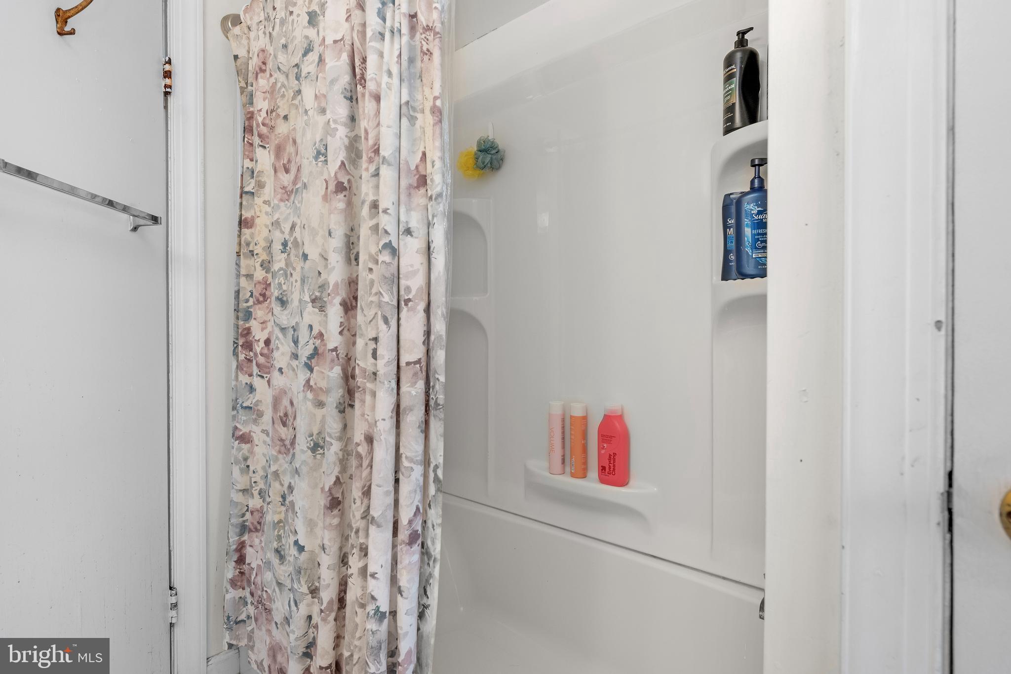730 McAllister Street Hanover, PA 17331 - Photo 22 of 46 a white wall with a shower curtain and a shower