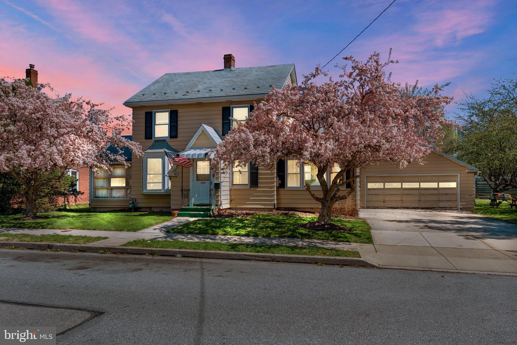 730 McAllister Street Hanover, PA 17331 - Photo 46 of 46 a front view of a house with a garden and tree
