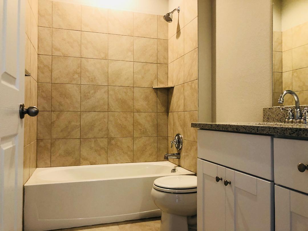 1308 Eagle Ridge Trail Leander, TX 78641 - Photo 10 of 16 Bathroom with vanity and shower / washtub combination