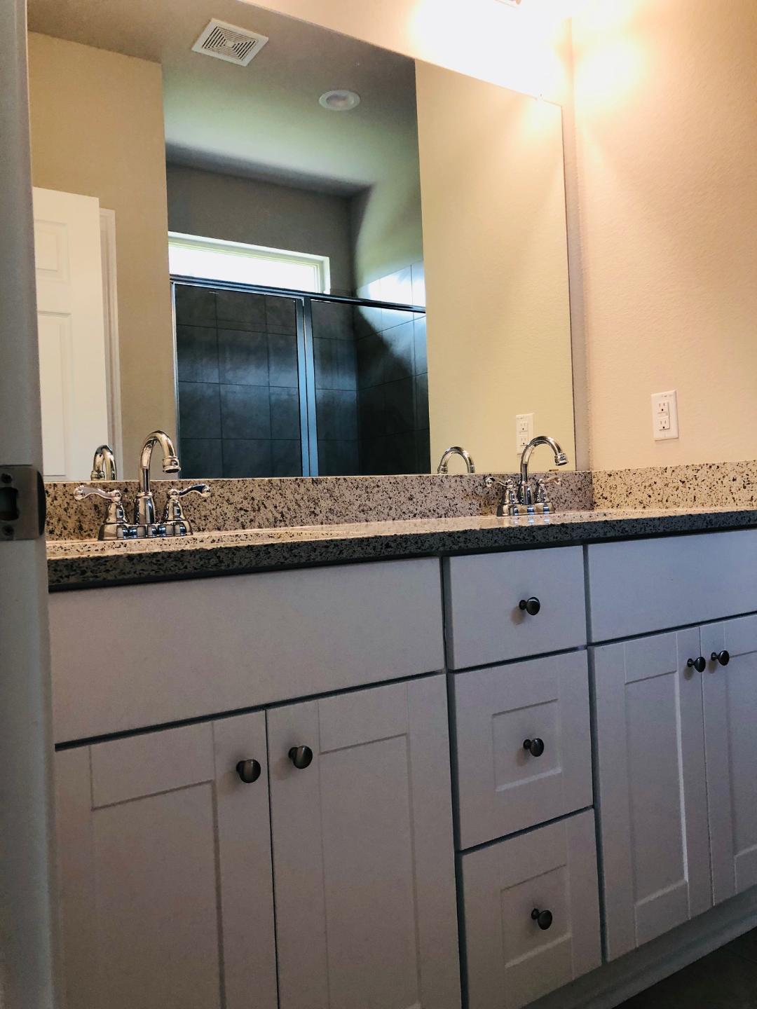 1308 Eagle Ridge Trail Leander, TX 78641 - Photo 8 of 16 Full bath with double vanity and a stall shower