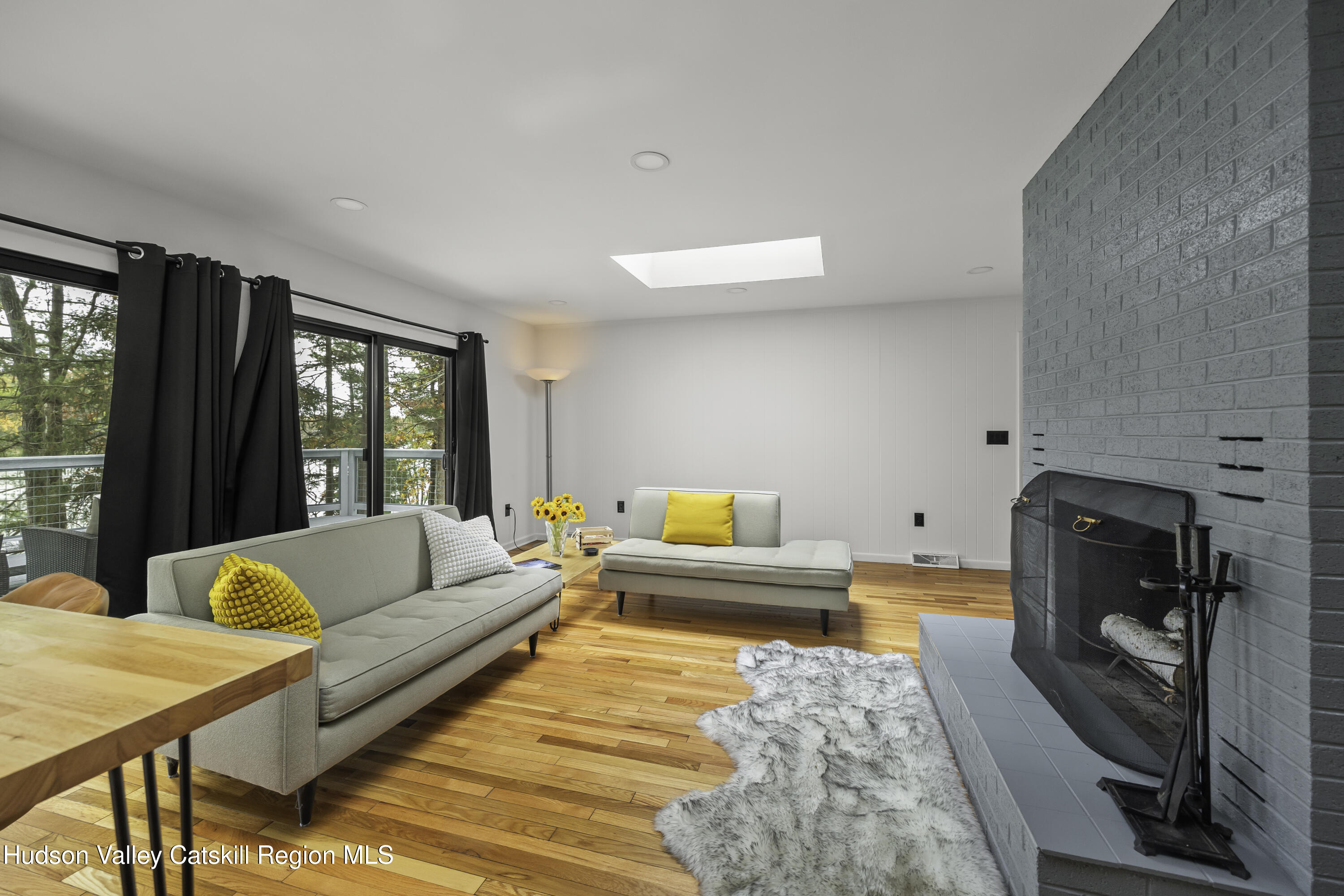 1256 Lakeview Road Copake, NY 12516 - Photo 12 of 37 a living room with furniture and a large window
