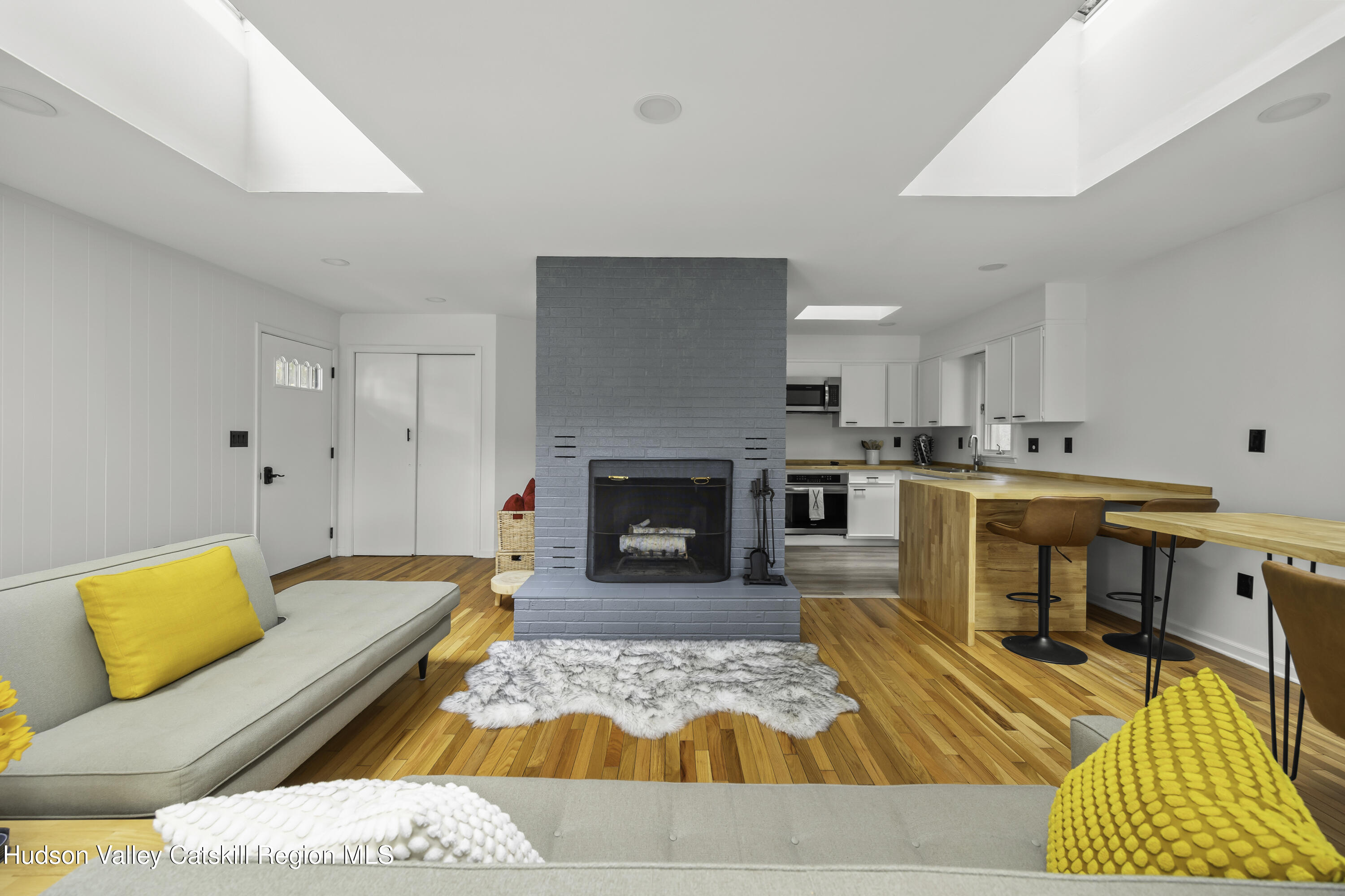 1256 Lakeview Road Copake, NY 12516 - Photo 13 of 37 a living room with furniture and a fireplace