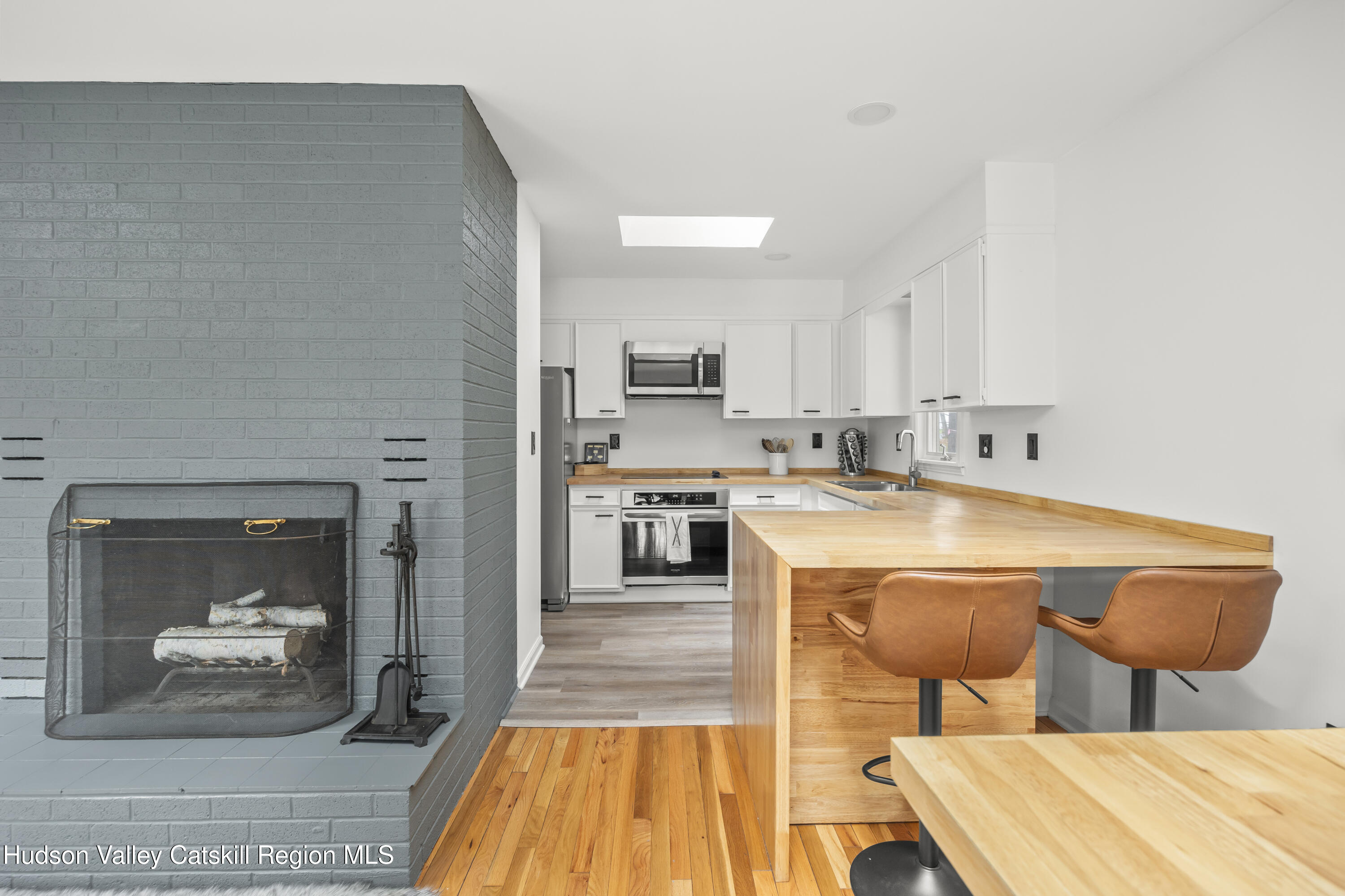 1256 Lakeview Road Copake, NY 12516 - Photo 15 of 37 a open kitchen with stainless steel appliances granite countertop a stove and a sink with cabinets