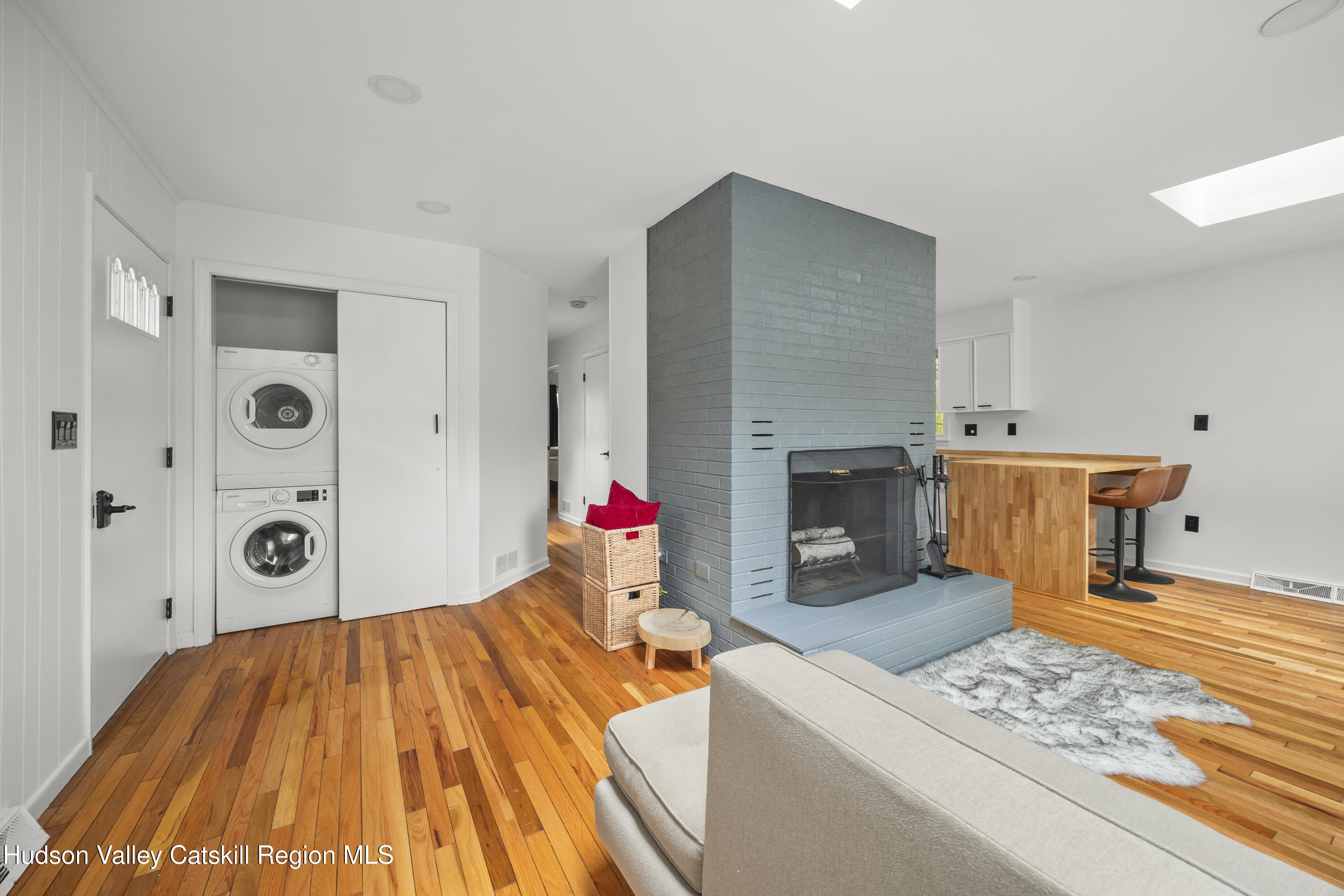 1256 Lakeview Road Copake, NY 12516 - Photo 16 of 37 a bedroom with a bed and a fireplace