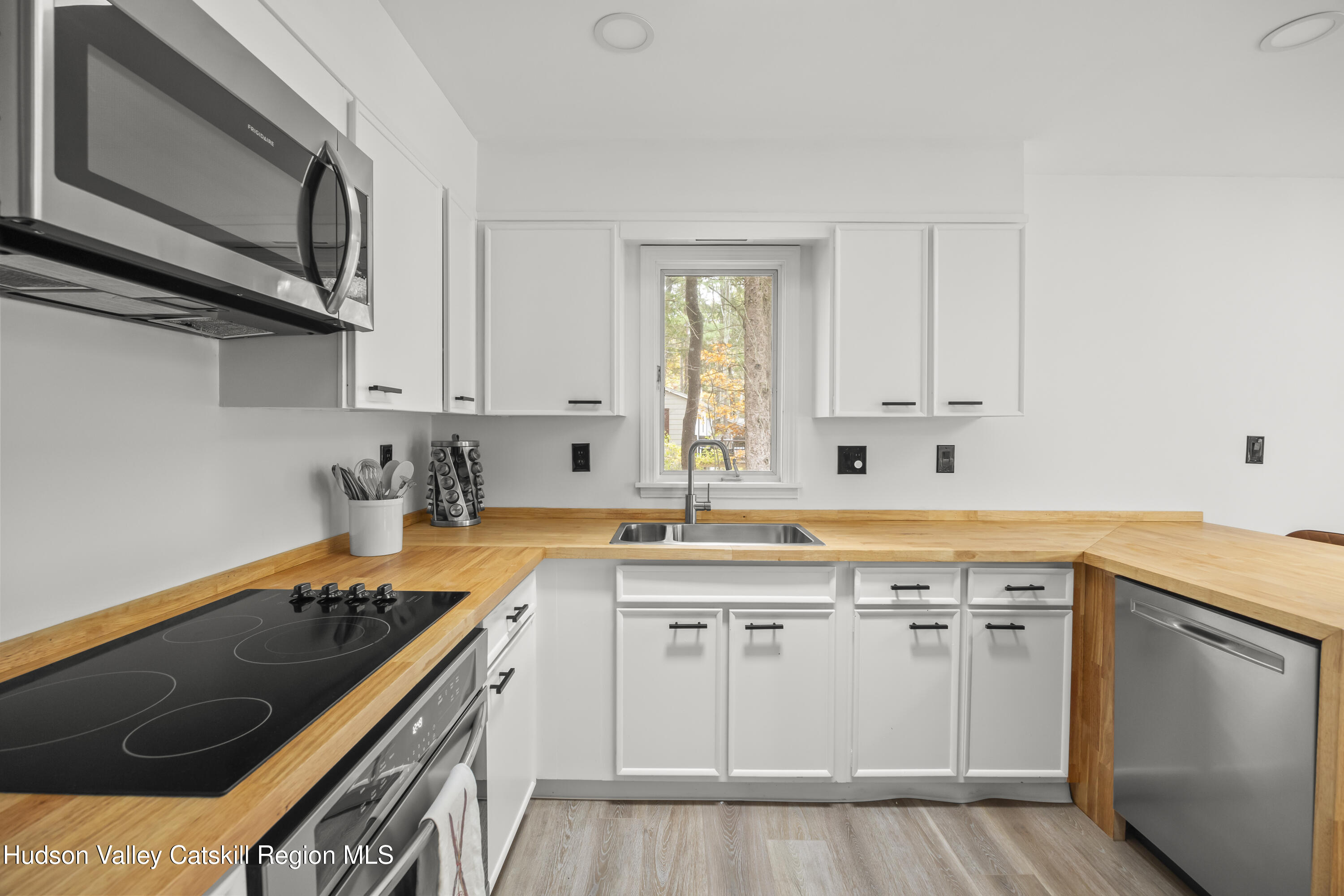 1256 Lakeview Road Copake, NY 12516 - Photo 17 of 37 a kitchen with stainless steel appliances granite countertop a sink and cabinets