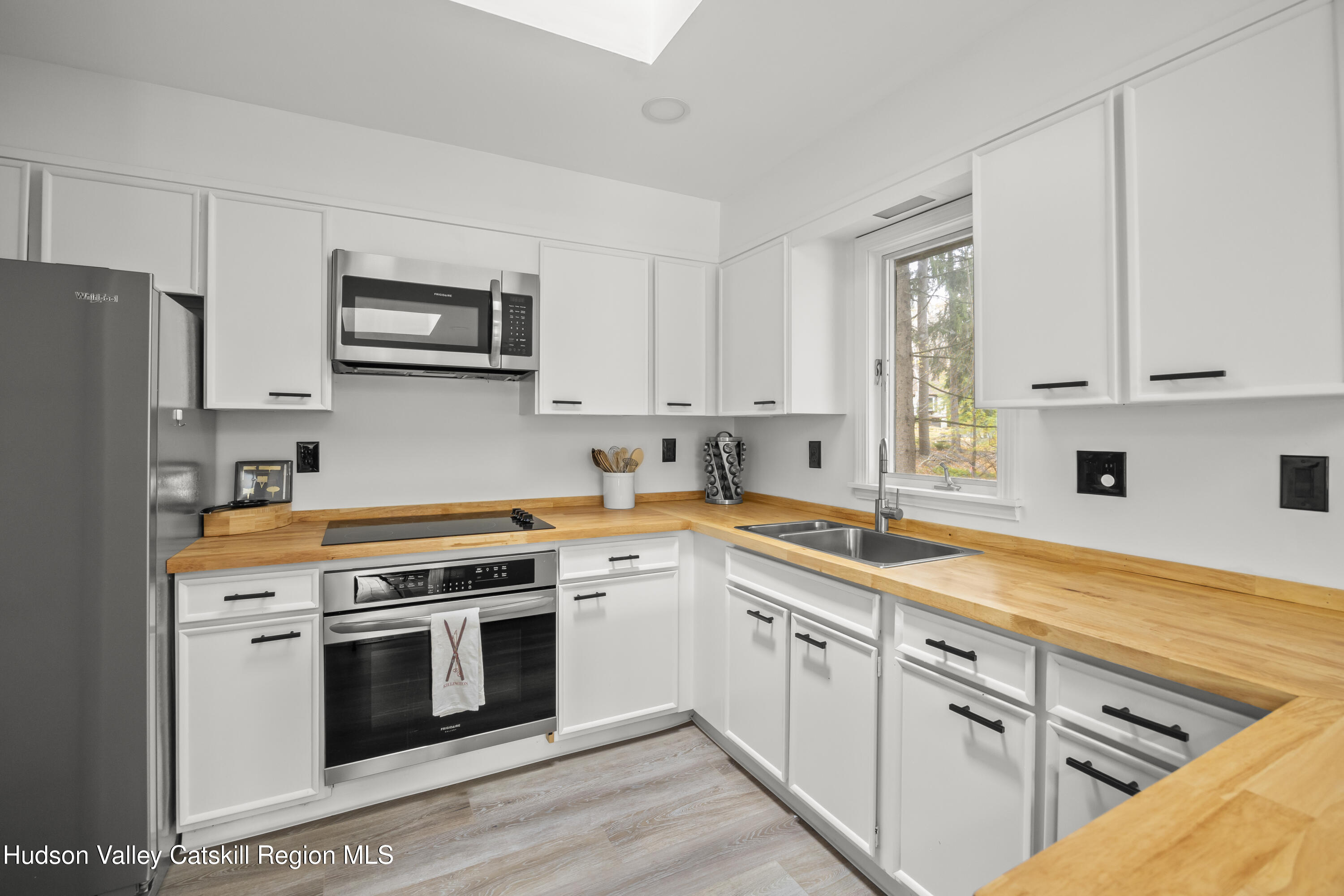 1256 Lakeview Road Copake, NY 12516 - Photo 18 of 37 a kitchen with cabinets stainless steel appliances and sink