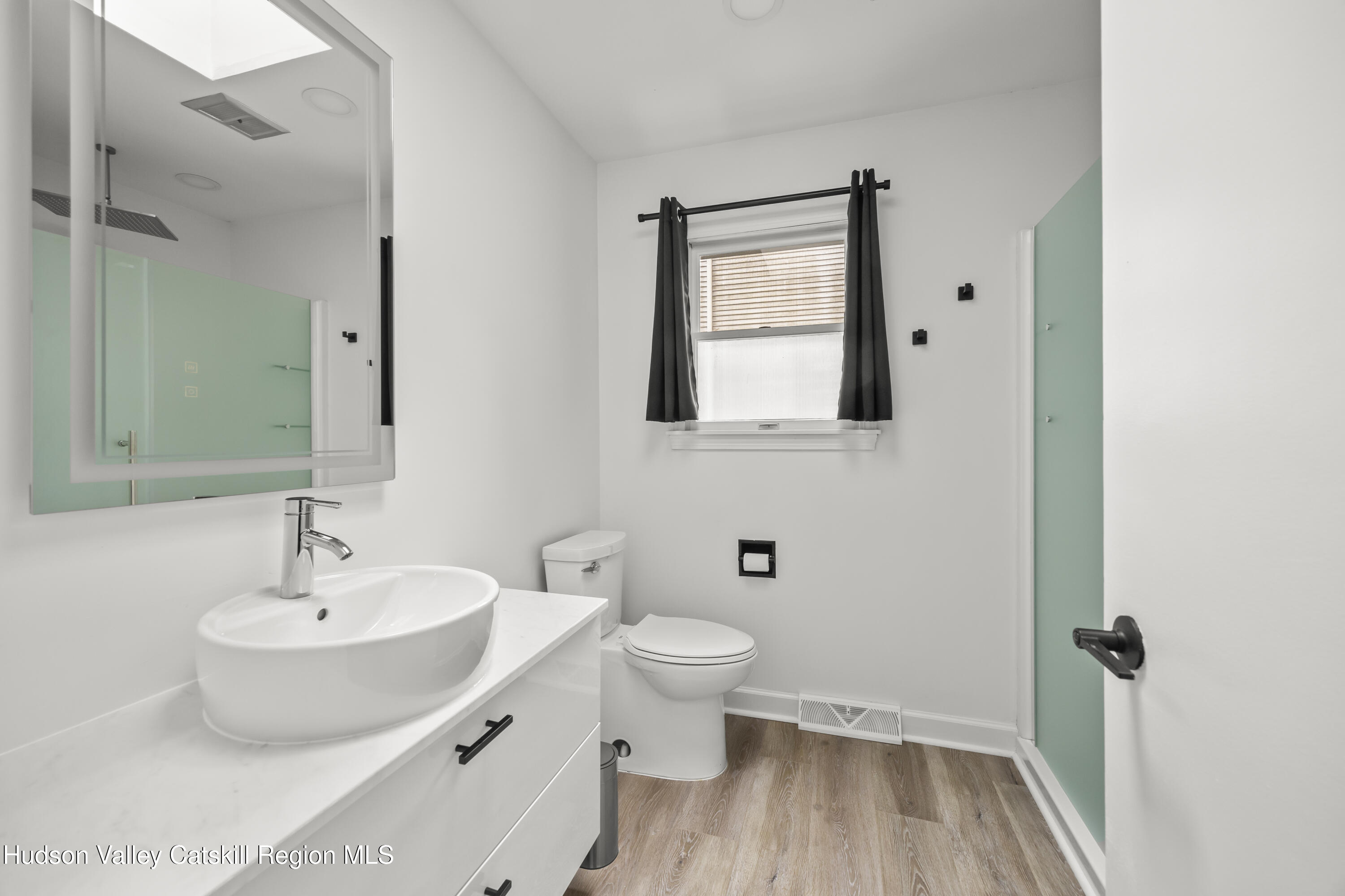 1256 Lakeview Road Copake, NY 12516 - Photo 19 of 37 a bathroom with a sink and a mirror