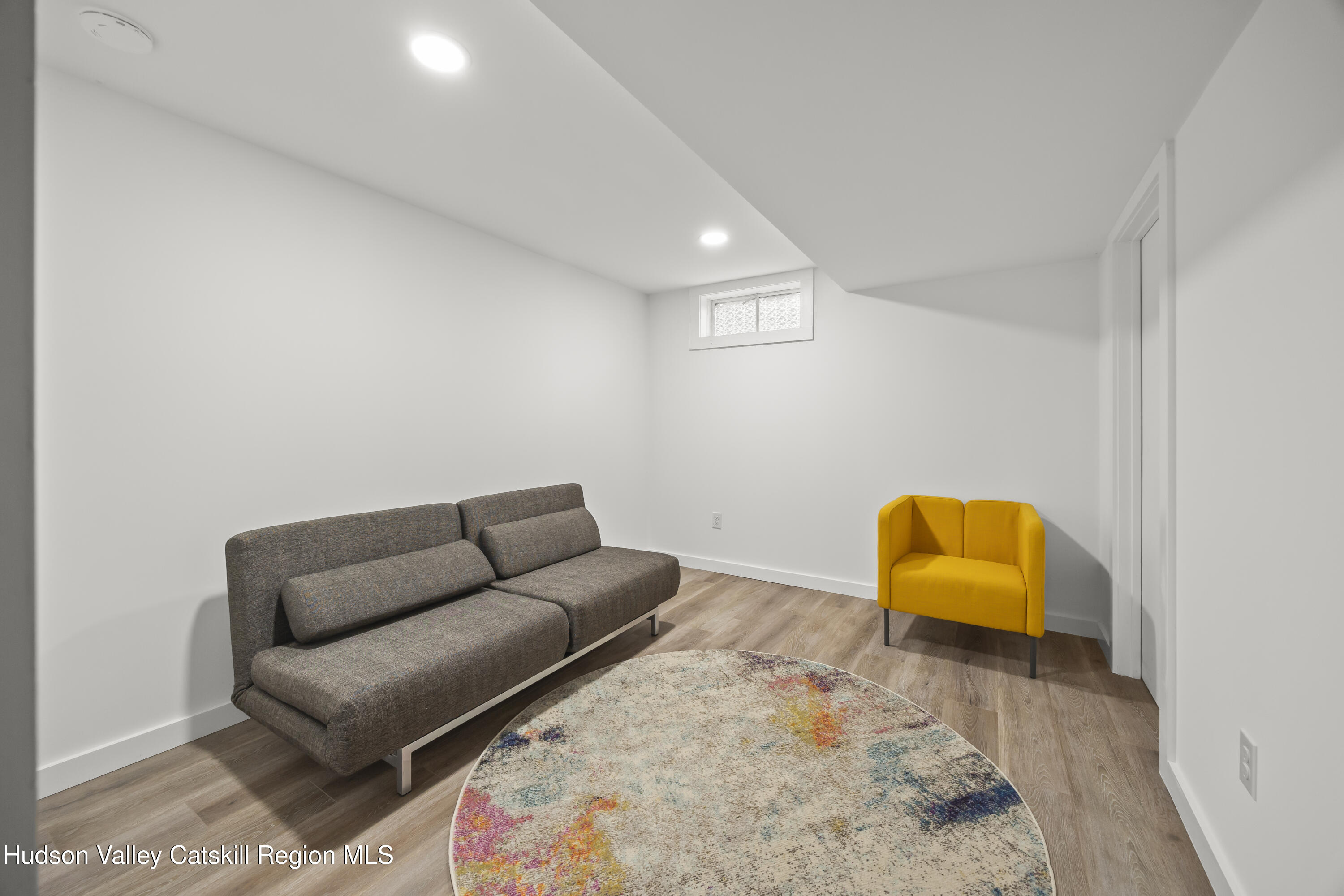 1256 Lakeview Road Copake, NY 12516 - Photo 24 of 37 a living room with furniture and a couch