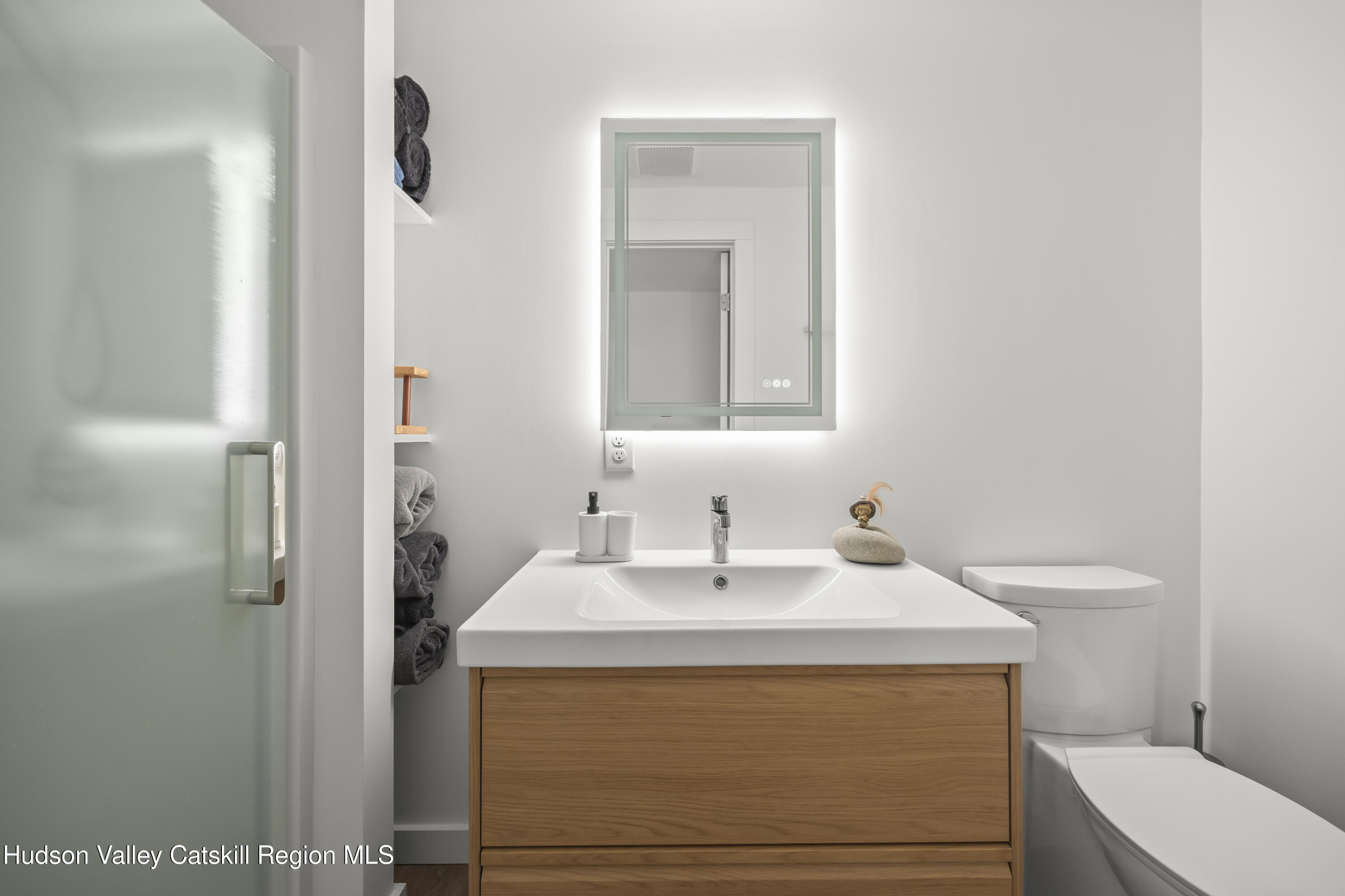 1256 Lakeview Road Copake, NY 12516 - Photo 29 of 37 a bathroom with a sink a toilet and shower