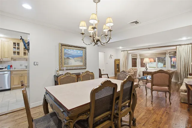 a view of a dining room with furniture and window
