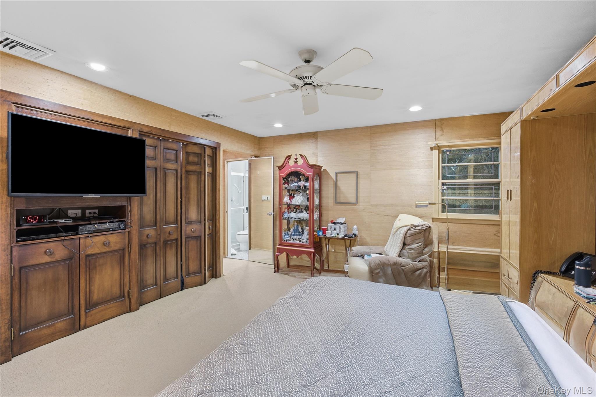 7 Judith Street Plainview, NY 11803 - Photo 24 of 45 Bedroom with a ceiling fan, light colored carpet, ensuite bath, and recessed lighting