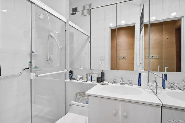 a bedroom with bed and wooden floor