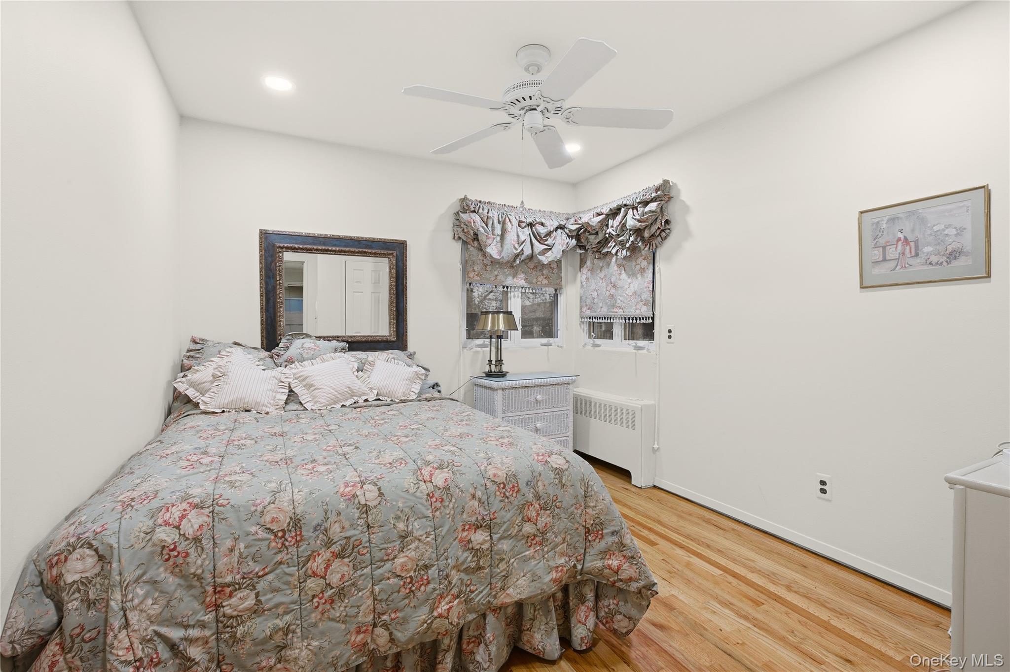 7 Judith Street Plainview, NY 11803 - Photo 28 of 45 Bedroom with light wood-type flooring, radiator heating unit, a ceiling fan, and recessed lighting