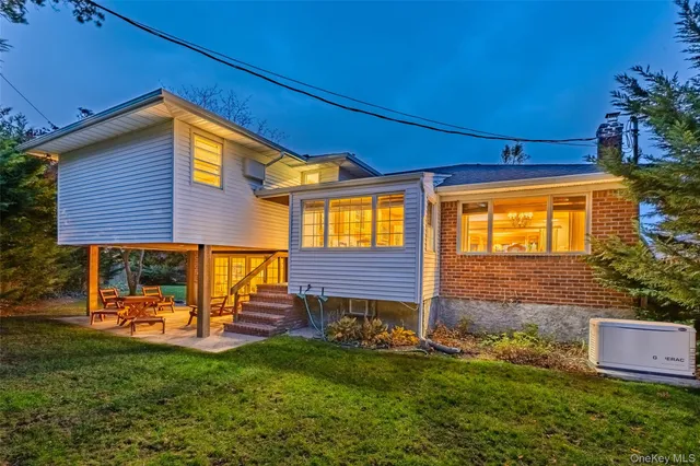 a view of a house with a backyard