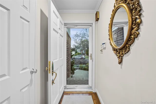 a view of entryway with wooden floor