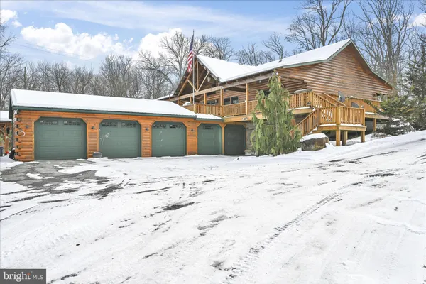 a view of a house with snow on the background