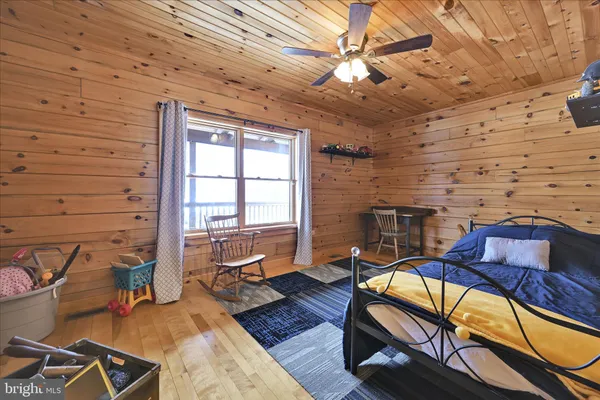a bed room with a bed and a window