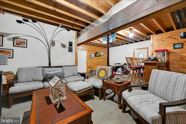 a view of balcony with couch and wooden floor