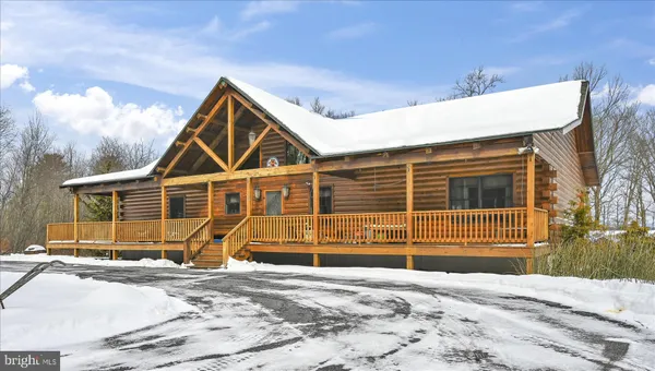 a view of a house with a snow in the yard