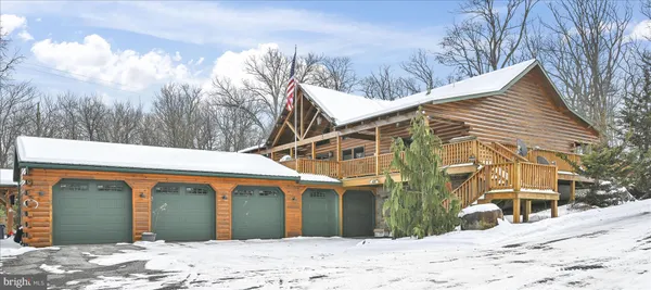 a view of a house with a snow on the road