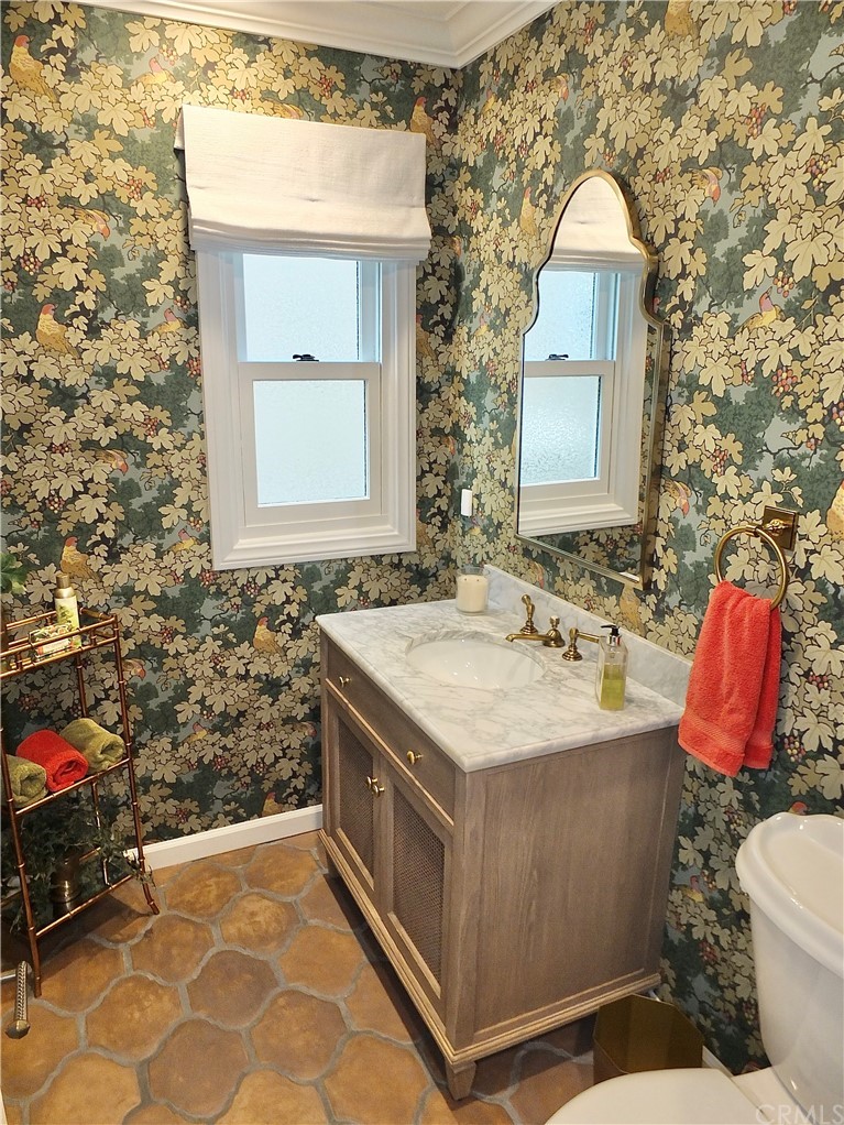 5273 Appian Way Long Beach, CA 90803 - Photo 12 of 34 a bathroom with a sink toilet and a mirror