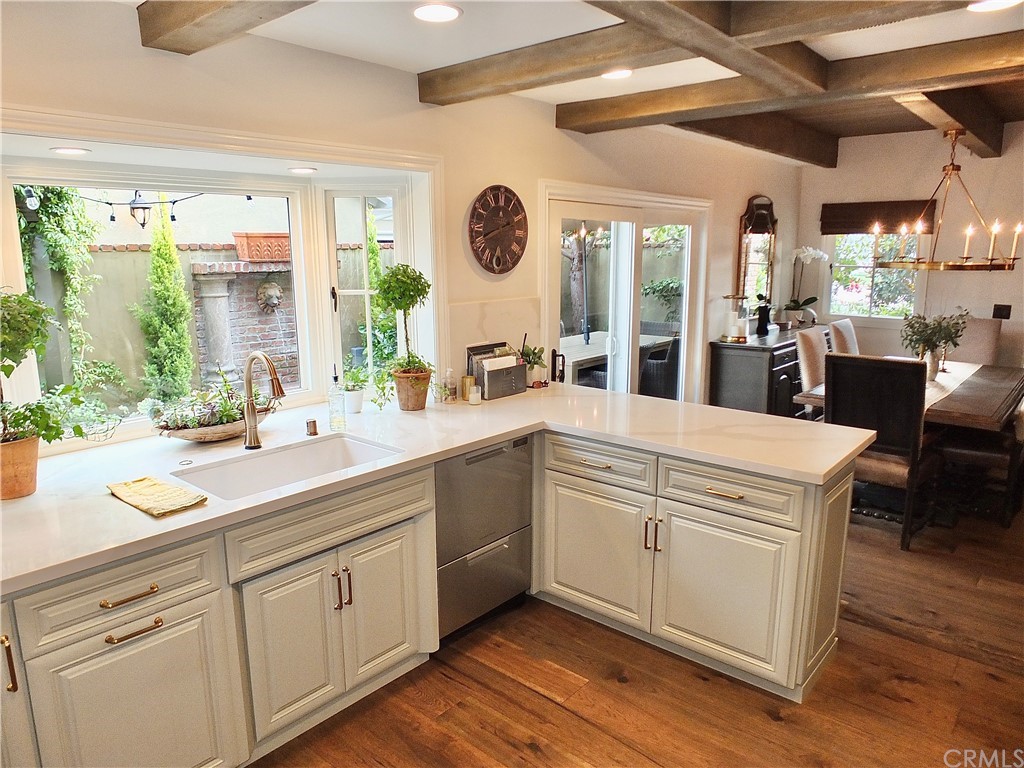 5273 Appian Way Long Beach, CA 90803 - Photo 14 of 34 a kitchen with cabinets a sink and appliances