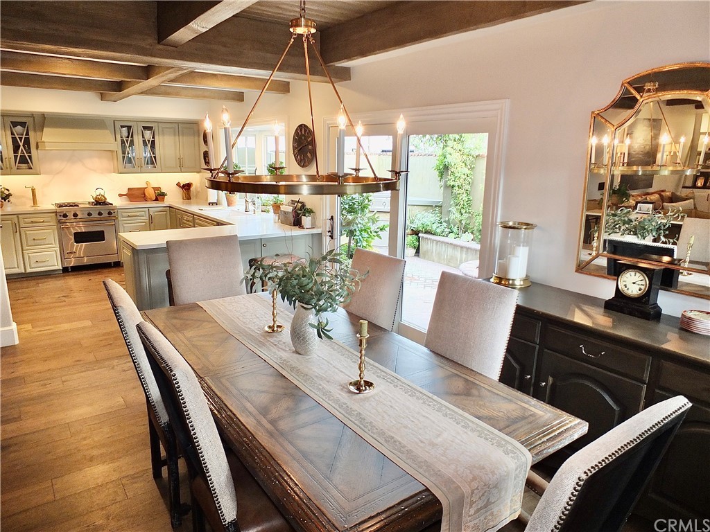 5273 Appian Way Long Beach, CA 90803 - Photo 15 of 34 a view of a dining room with furniture wooden floor and chandelier