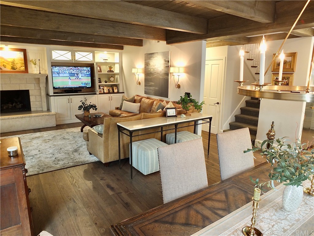 5273 Appian Way Long Beach, CA 90803 - Photo 20 of 34 a living room with furniture a flat screen tv and a large window