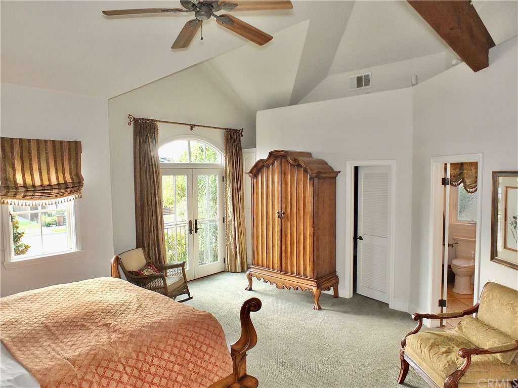 5273 Appian Way Long Beach, CA 90803 - Photo 22 of 34 a bedroom with a bed dresser and a window