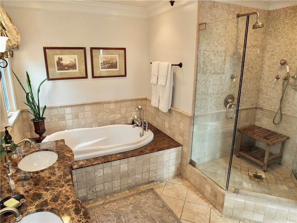 5273 Appian Way Long Beach, CA 90803 - Photo 23 of 34 a bath tub sitting next to a bathroom sink