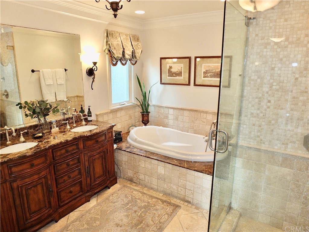 5273 Appian Way Long Beach, CA 90803 - Photo 24 of 34 a bathroom with a double vanity sink toilet and shower